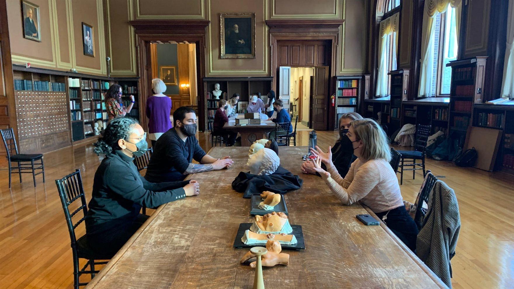 Students seated at a table during a class visit to the M&#252;tter Museum that employed historic artifacts and discussions. Photo courtesy Jacqui Bowman.
