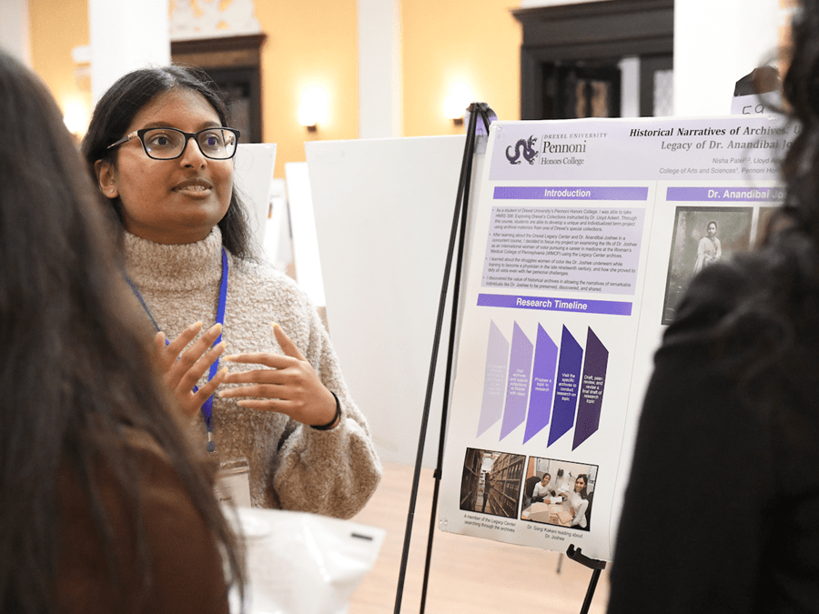 Student presenting their research at a conference