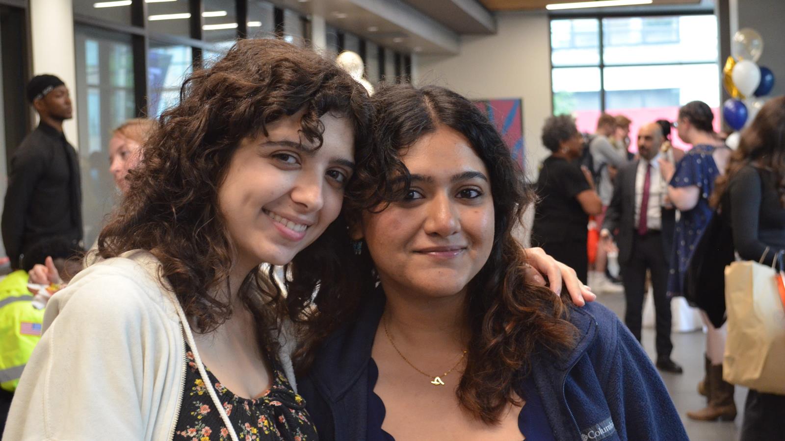 Two Honors students smiling at the camera