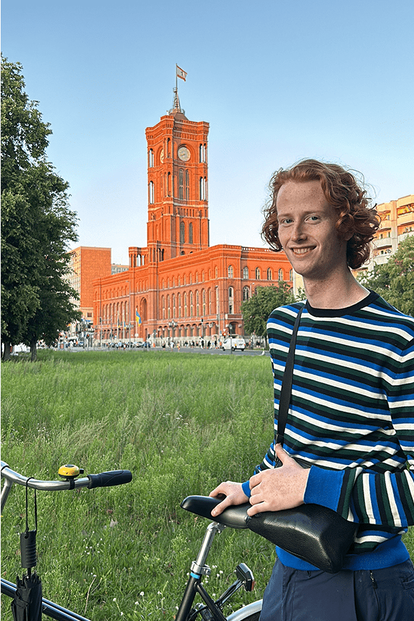 Aidan standing in front of a building