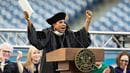 Sheryl Lee Ralph with arms raised while speaking at the podium at Drexel's 2024 Commencement.