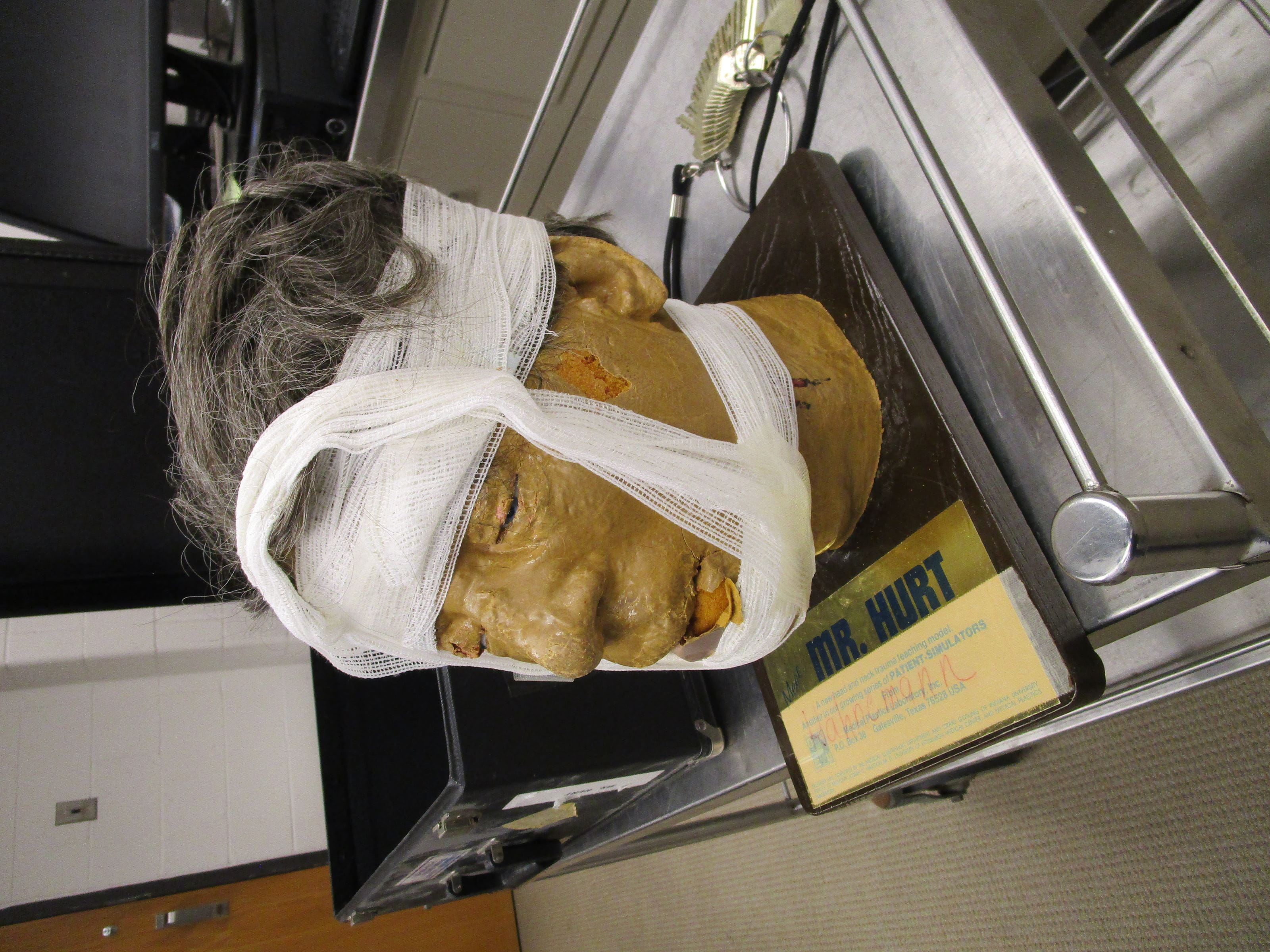 Mr. Hurt mannequin head in a box