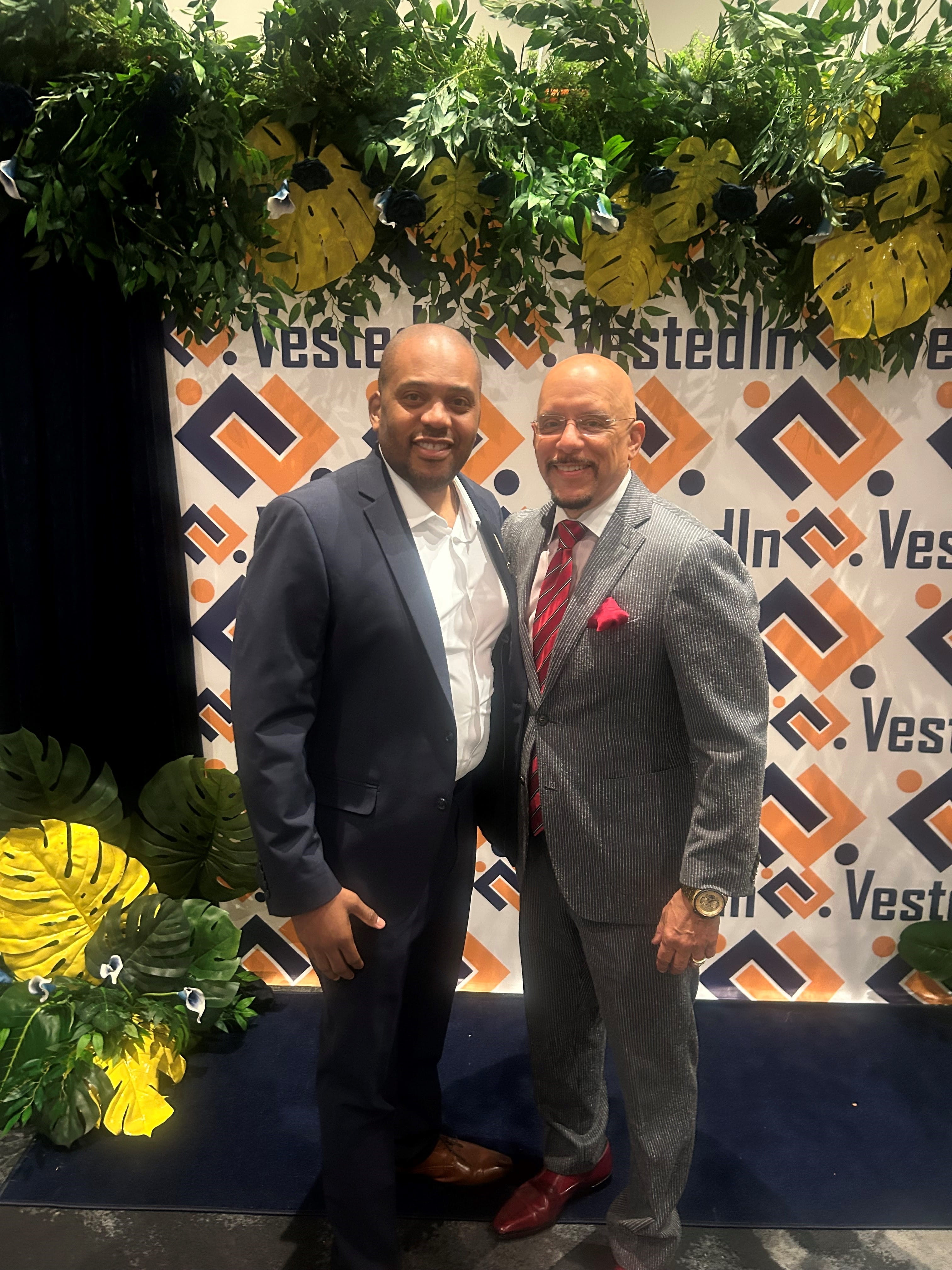 Allen Riddick (left) and Senator Vincent Hughes (right) at the VestedIn Opportunities Breakfast where Riddick was awarded his citation.