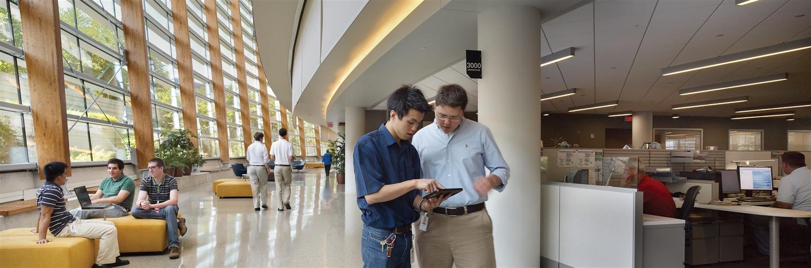 Student and professor in business building