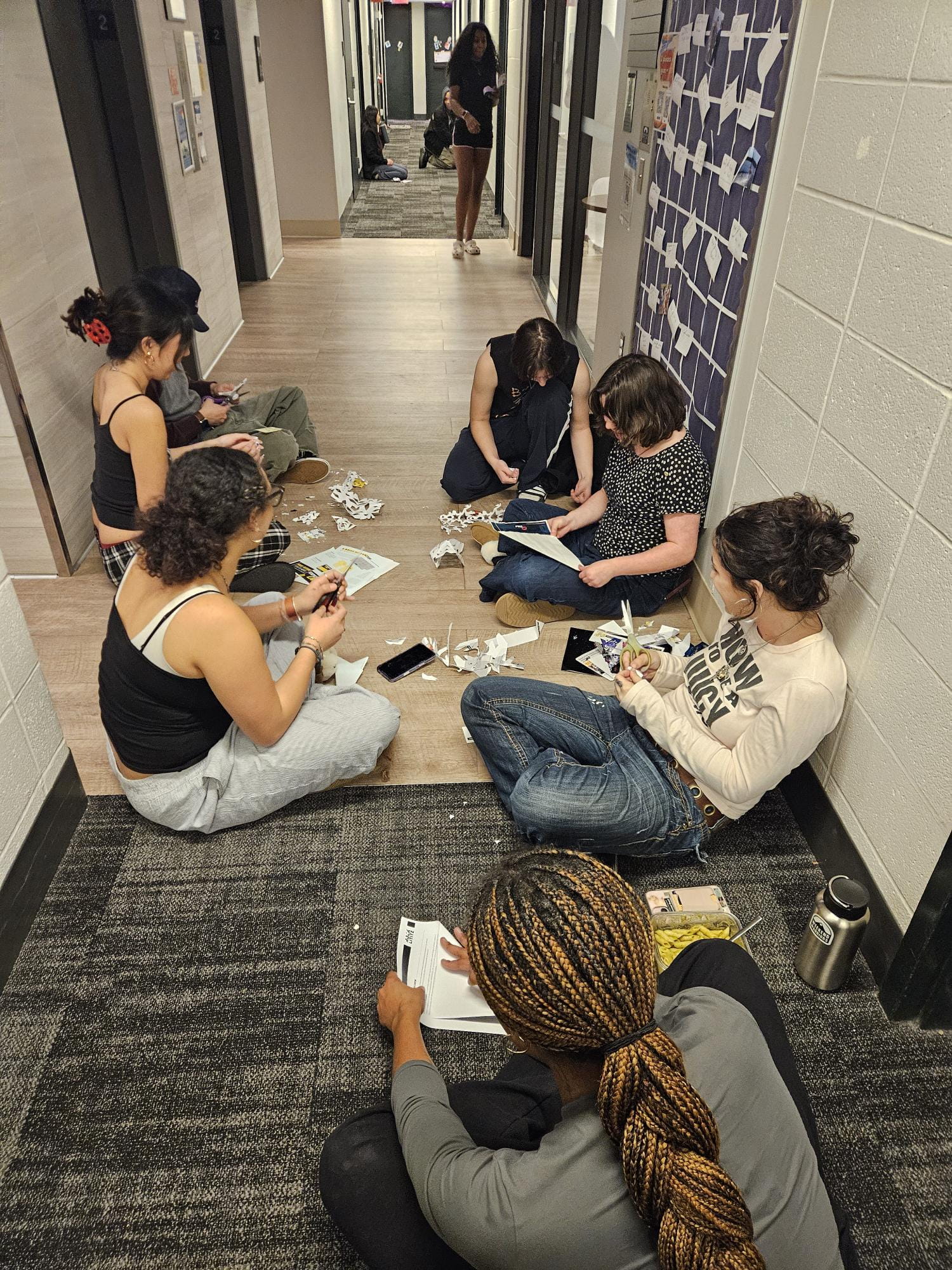 students crafting in the hallway