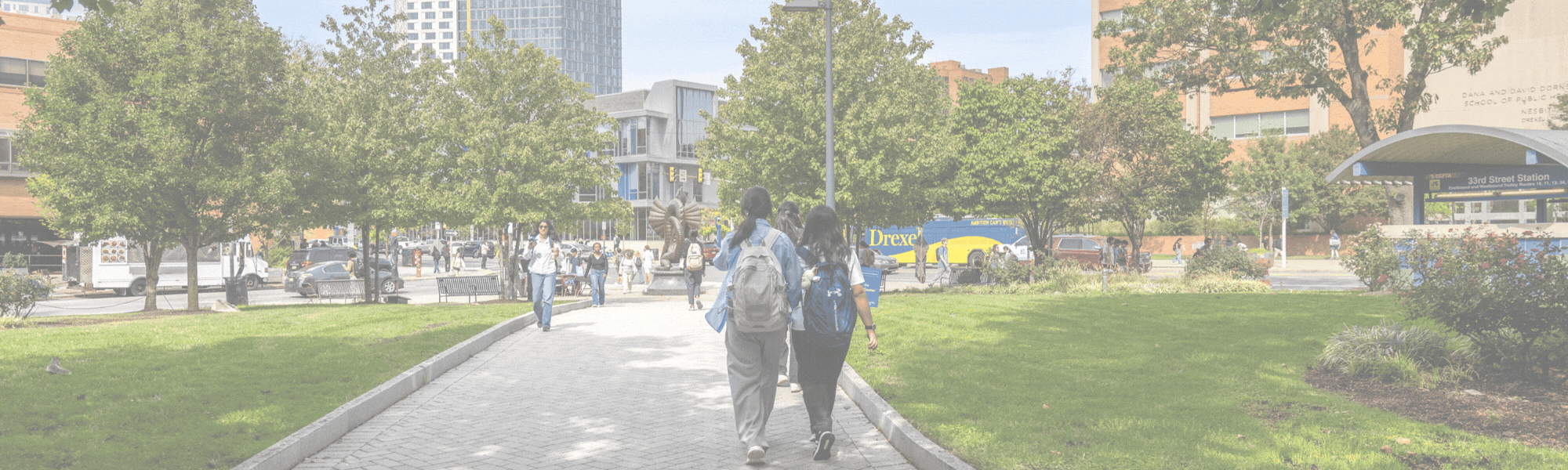 Two students walking on the Drexel campus