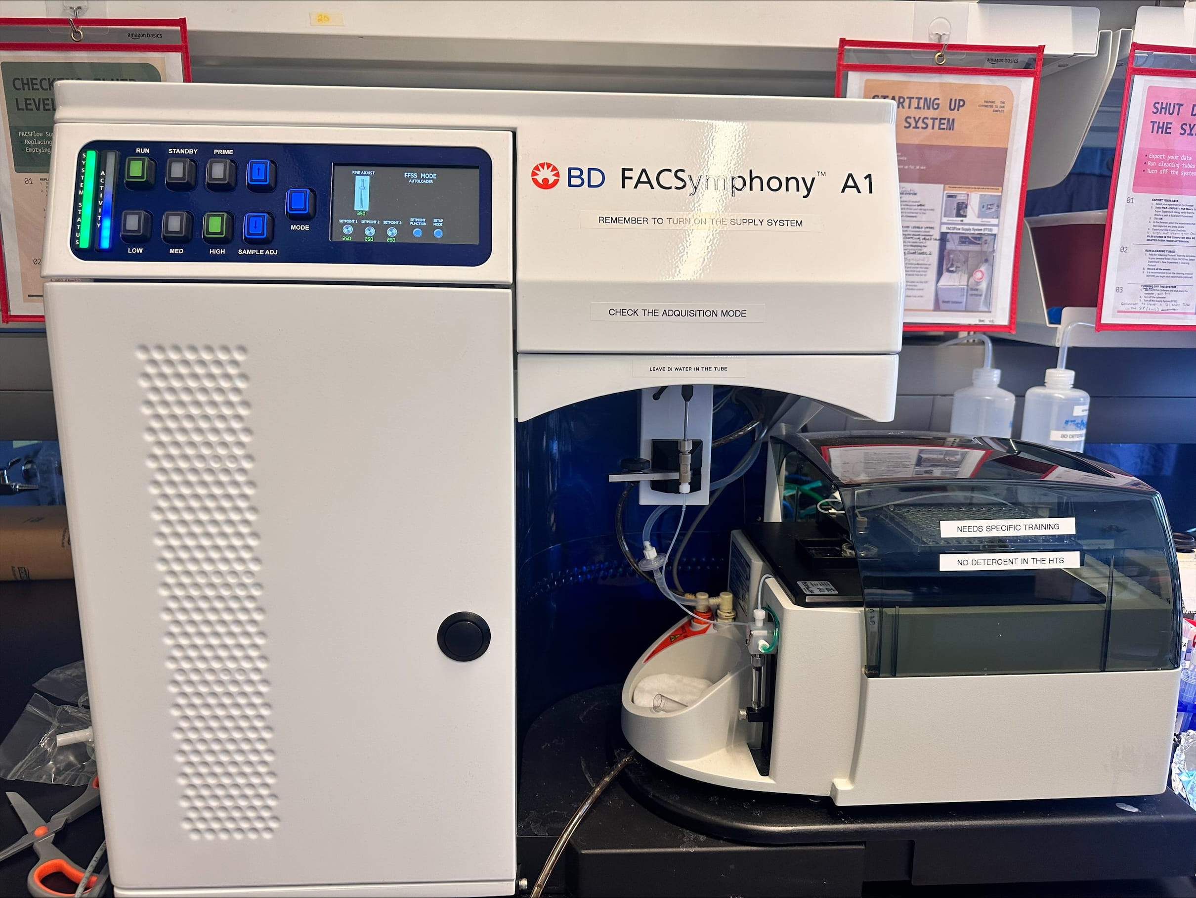 Cell Imaging Center's new flow cytometer, the BD FACSymphony A1. A large machine with many buttons connected to another machine via several tubes.