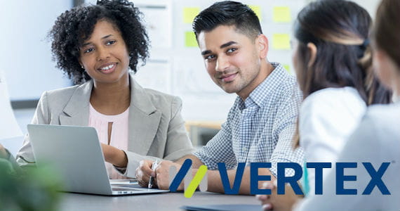 Group of professionals sitting and working together, Vertex logo in lower right corner 