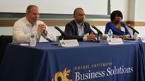 3 Business Leaders for Artificial Intelligence sitting at a table for panel discussion