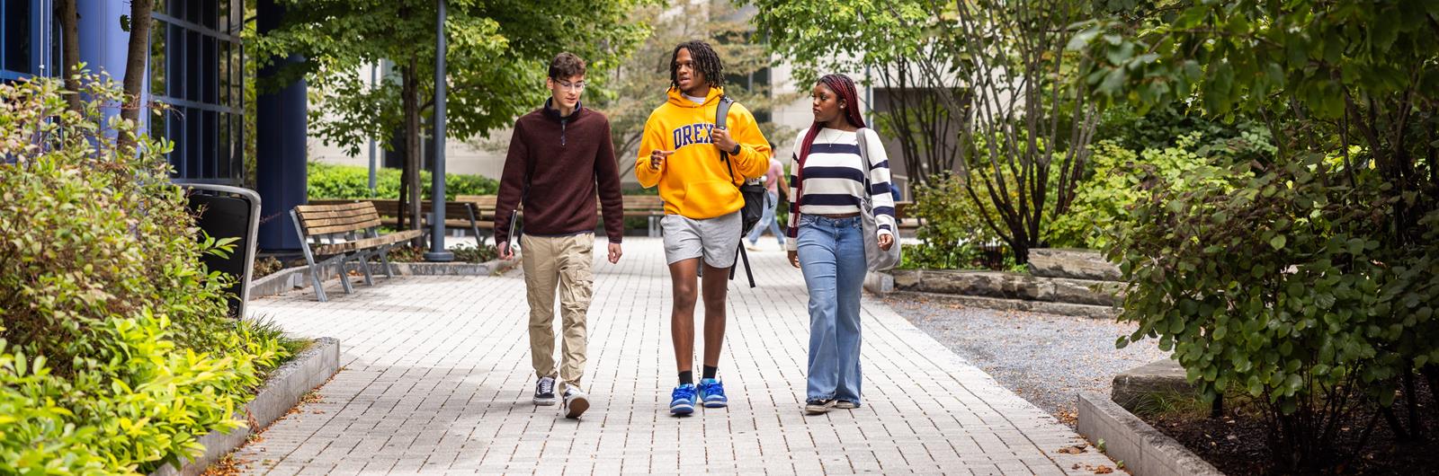 Three students walking on Drexel campus