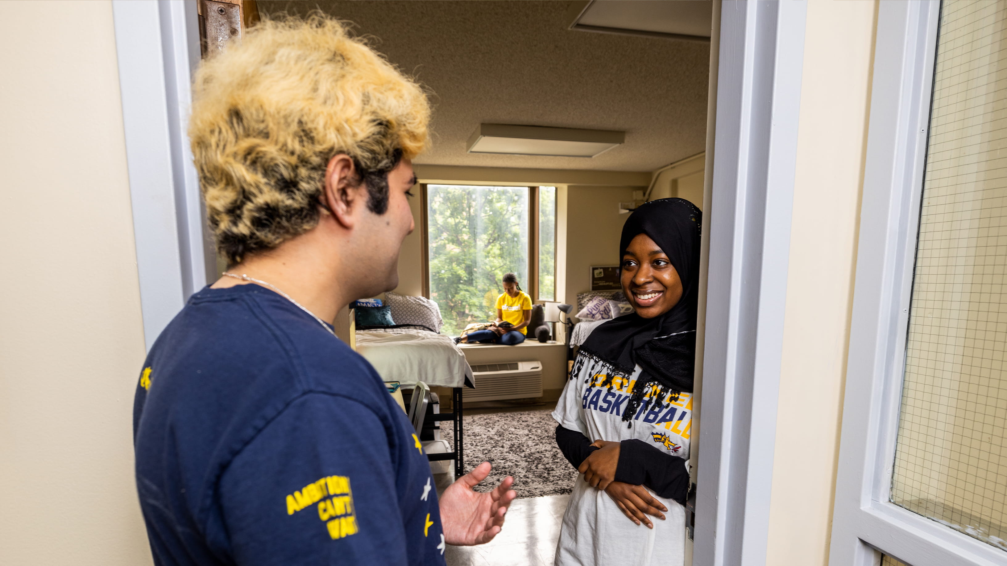 students outside dorm door