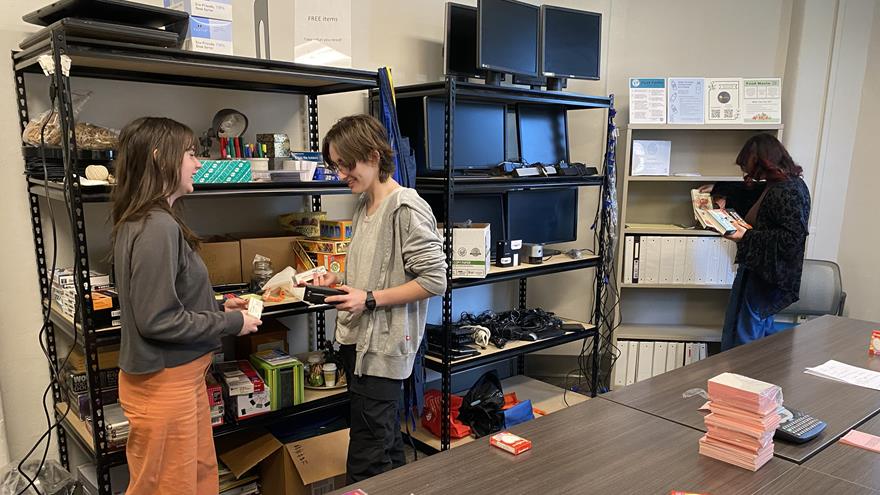 Students browsing the Drexel Buy Nothing Depot shelves