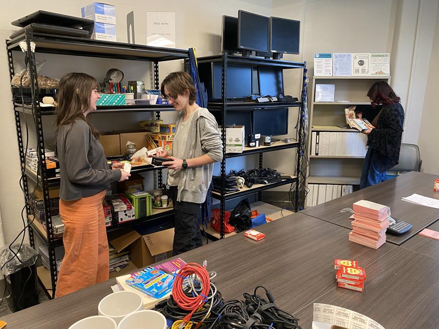Students browsing the Drexel Buy Nothing Depot shelves