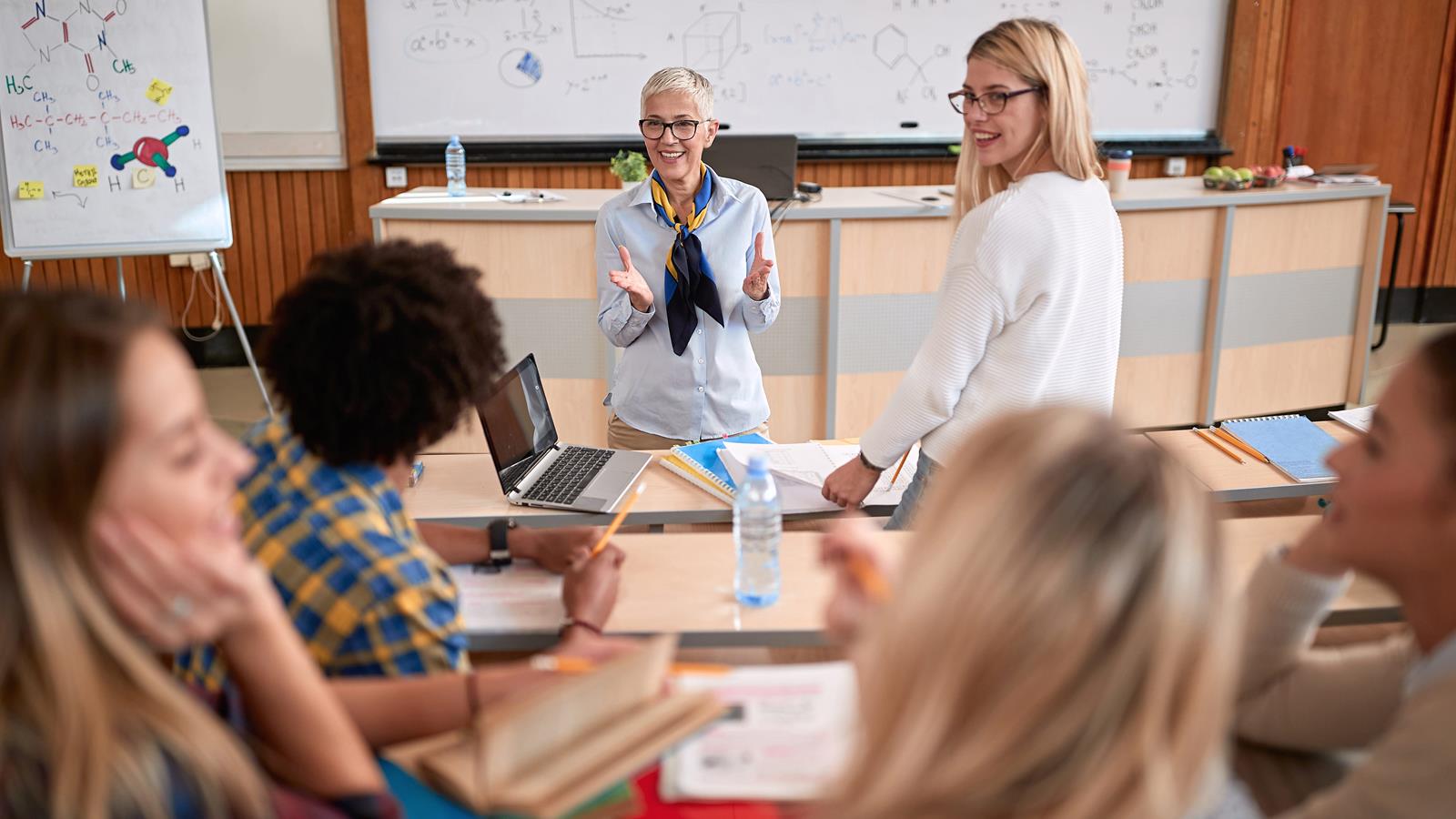 female professor addresses classroom