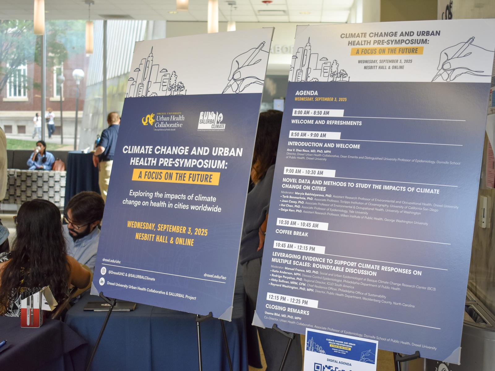 Sign printed with agenda for 2025 pre-symposium titled "Climate Change and Urban Health: A Focus on the Future" 