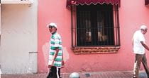 Two men walking down the street