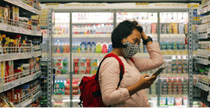 lady in face mask shopping in grocery store