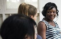 image of woman speaking to another woman
