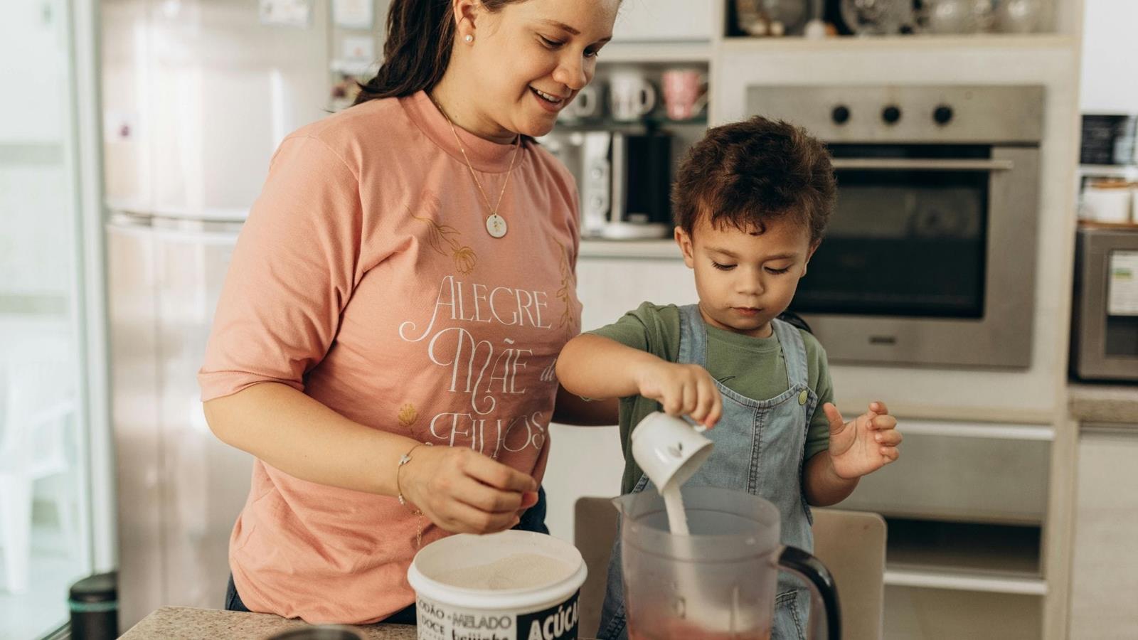 Child helping mother with baking