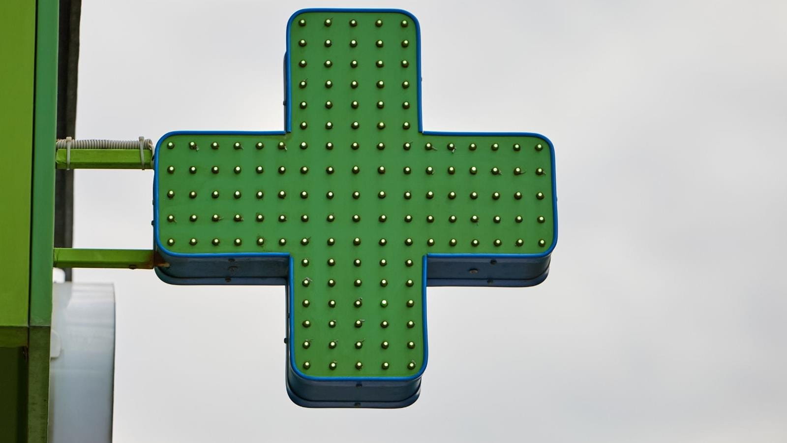 Green cross sign indicating cannabis dispensary