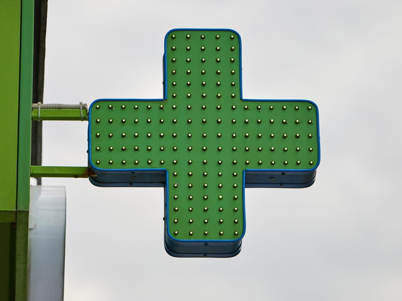 Green cross sign indicating cannabis dispensary