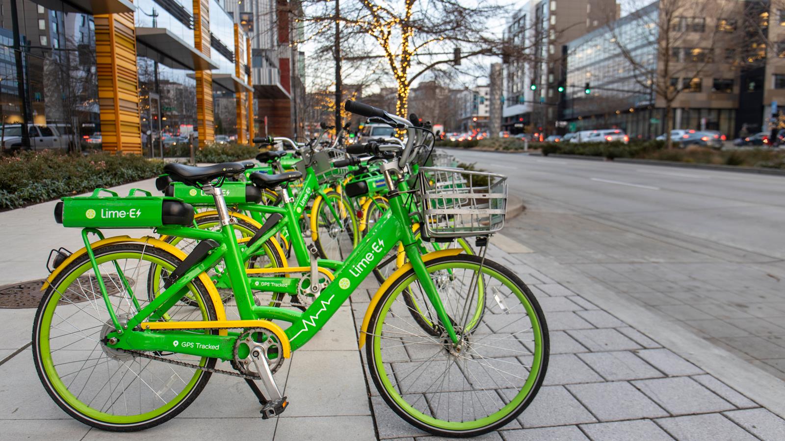 Lime e-bikes parked outside an office building in Seattle