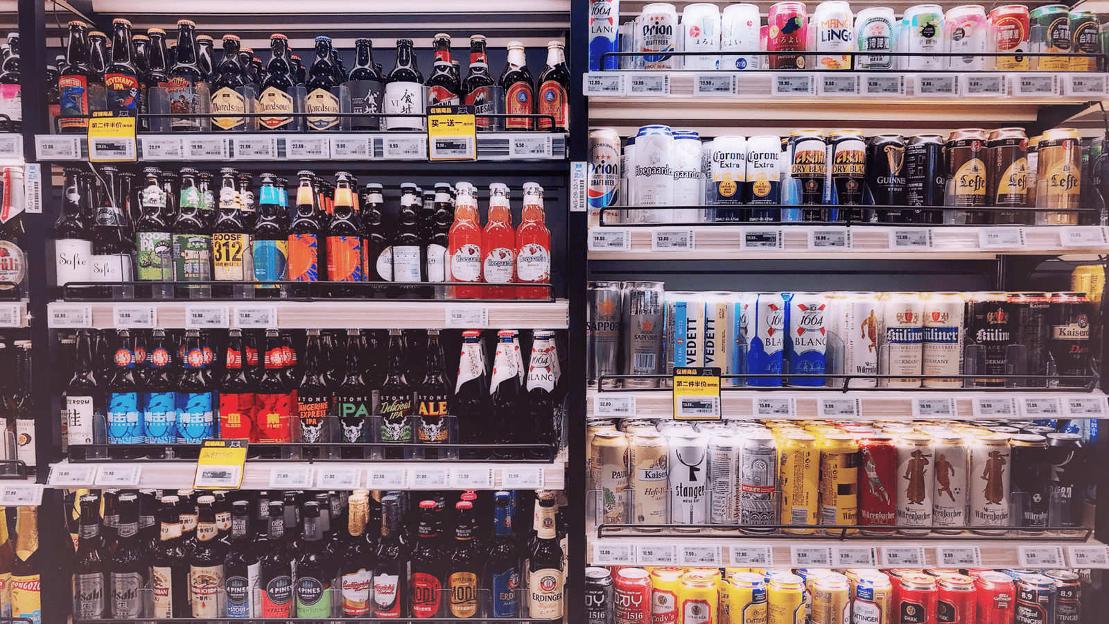 refrigerated shelves of alcoholic beverages