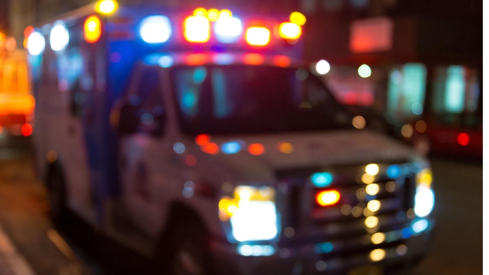 Blurry image of ambulance lights at night