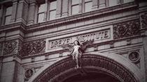 Drexel Institute on a building with a sculpture of an angel.