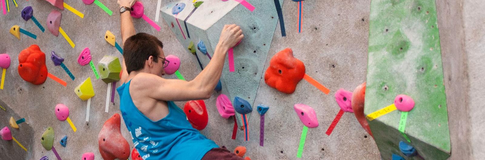 Person climbing a rock climbing wall