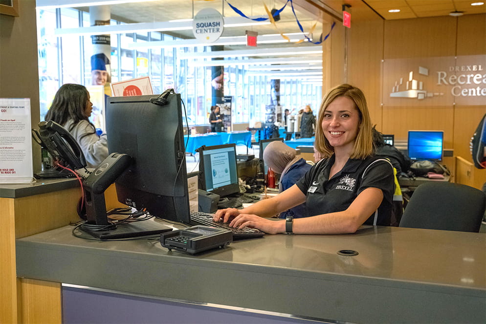 Employee at the front desk of Drexel Recreation Center