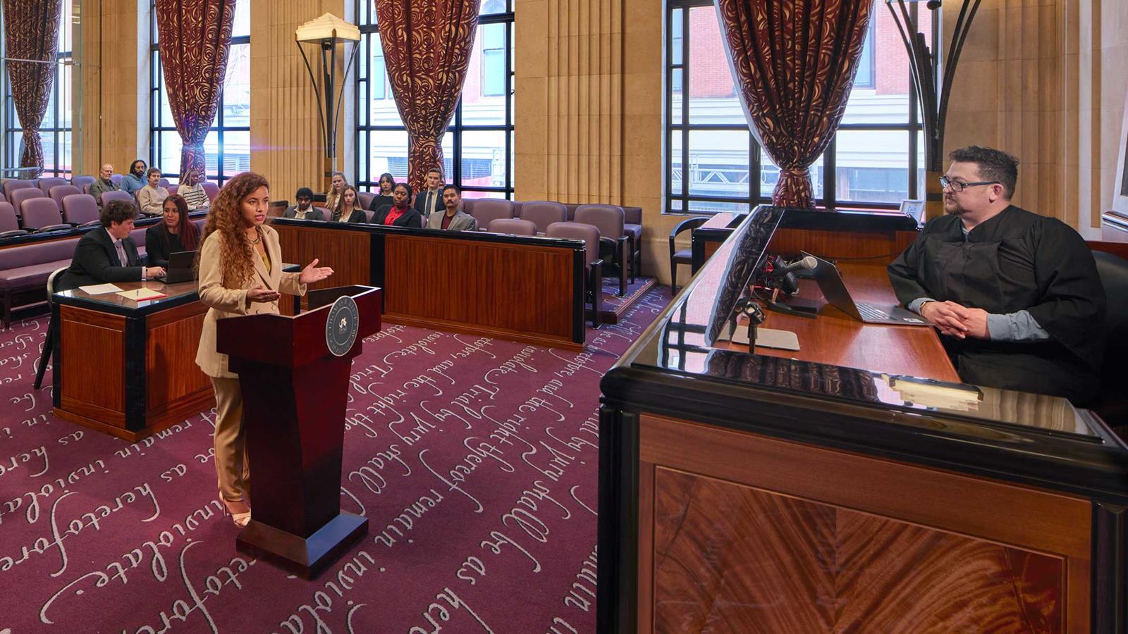 Drexel student in a mock trial in a courtroom setting