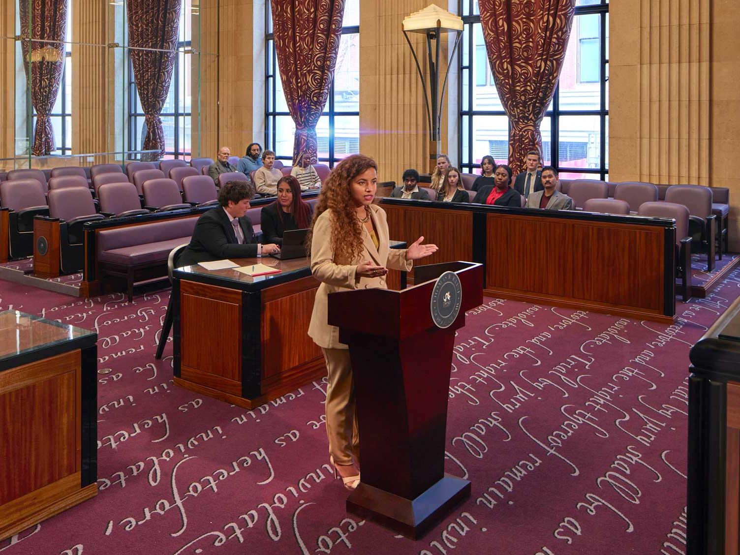 Drexel student in a mock trial in a courtroom setting