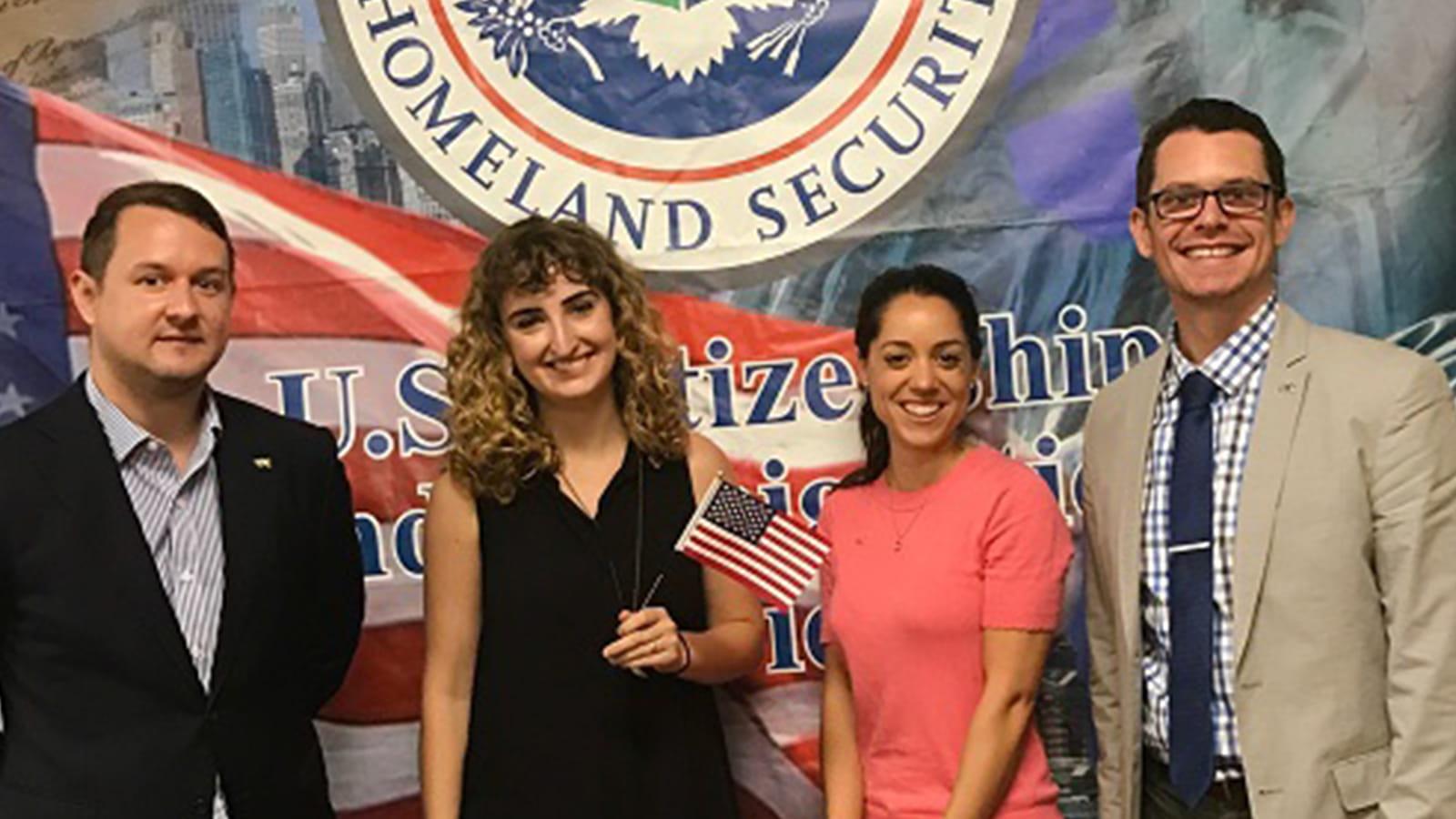Drexel Reps in front of a US Department of Homeland Security Banner