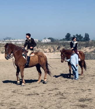 Jeannie D'Agostino riding horses in Pakistan