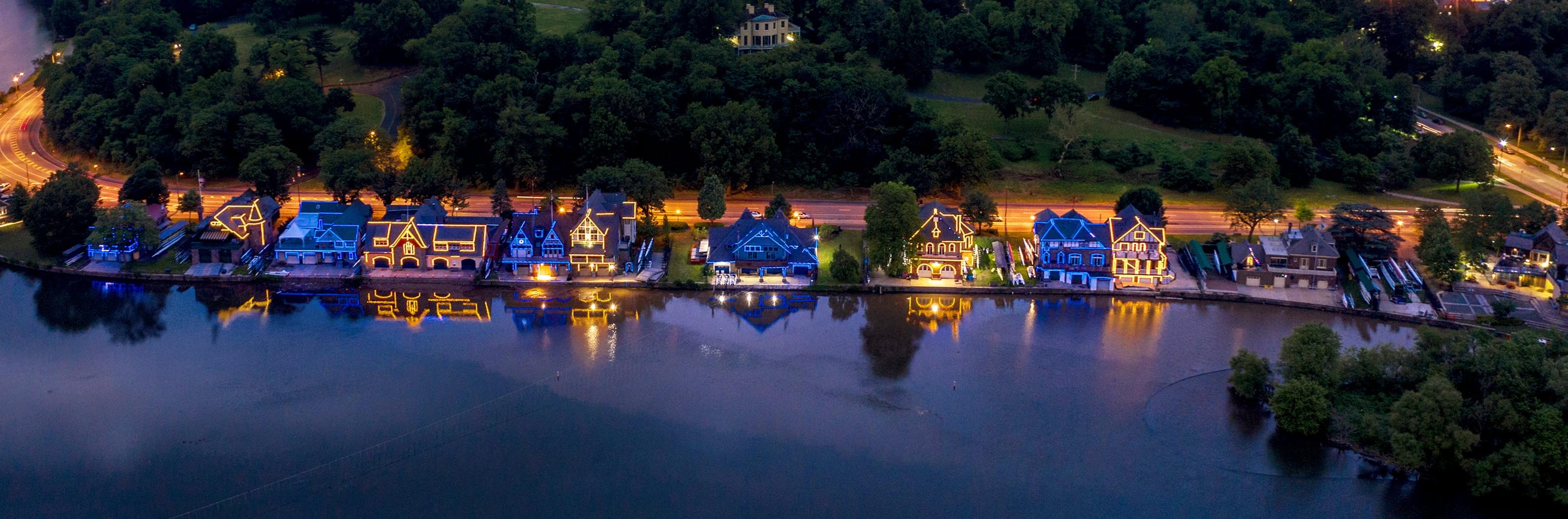 Boathouse row lit up during the evening