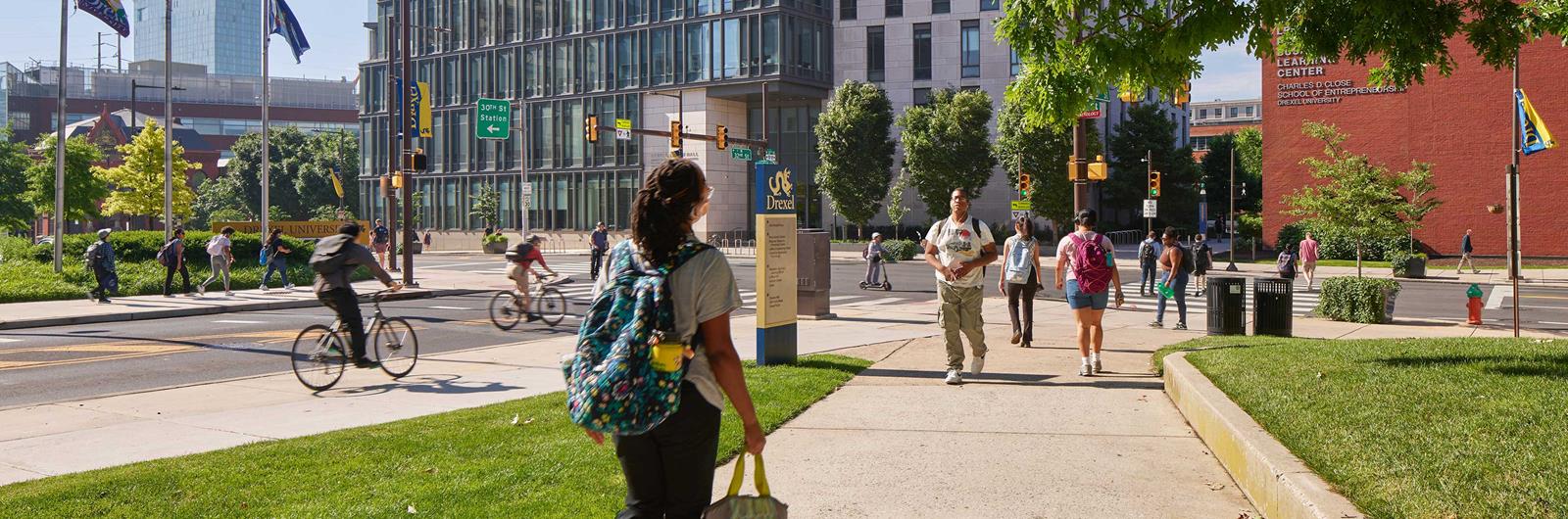 Woman walking to class on Drexel campus