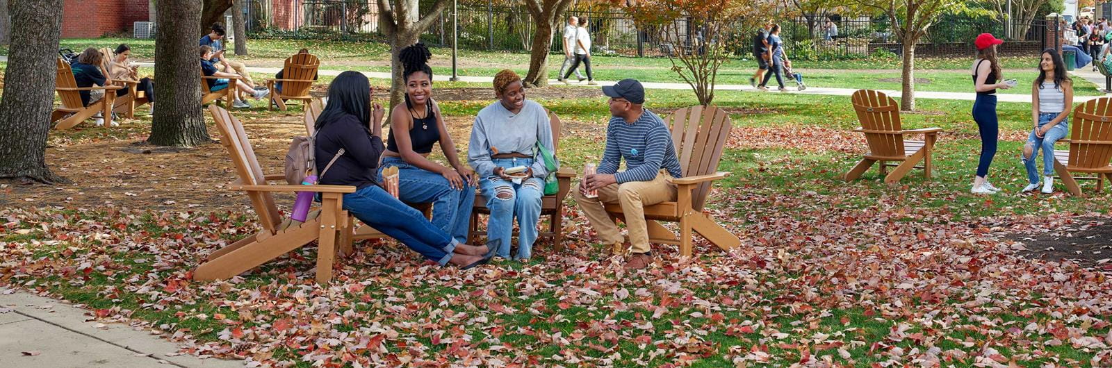 Seated students in conversation on Drexels Lancaster Walk