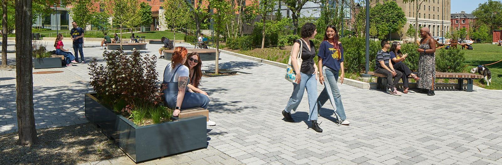 A group of students walking through Drexel University’s campus