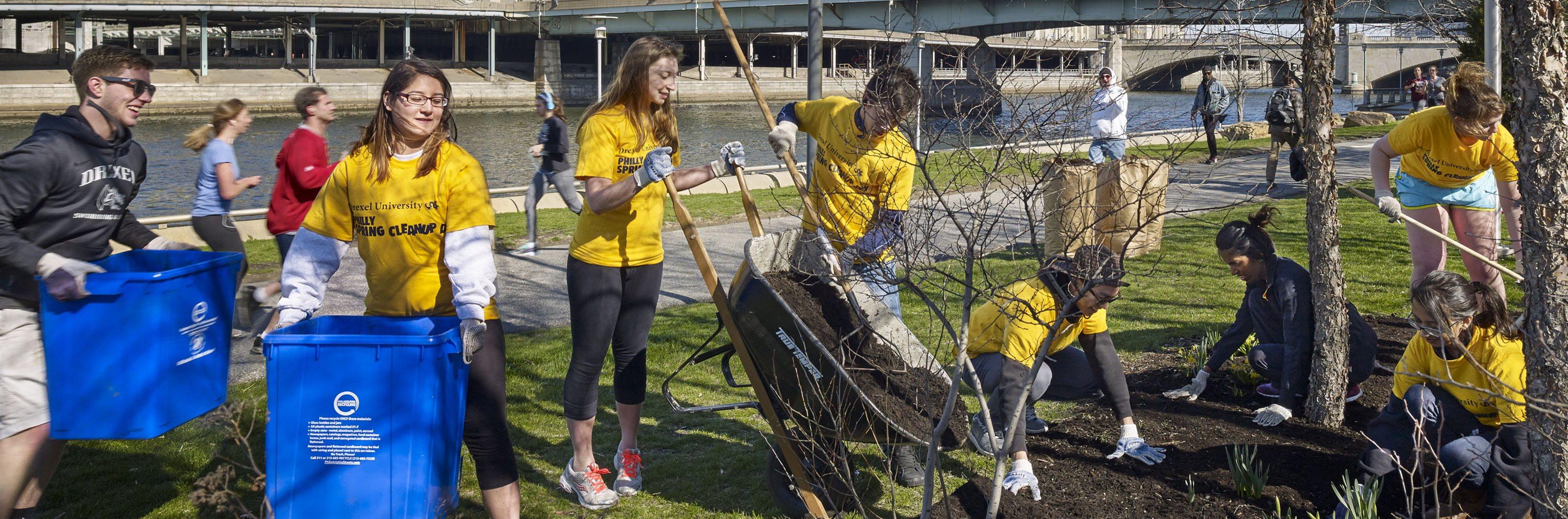 Student-volunteers planting and cleaning new beds along the Schuylkill River