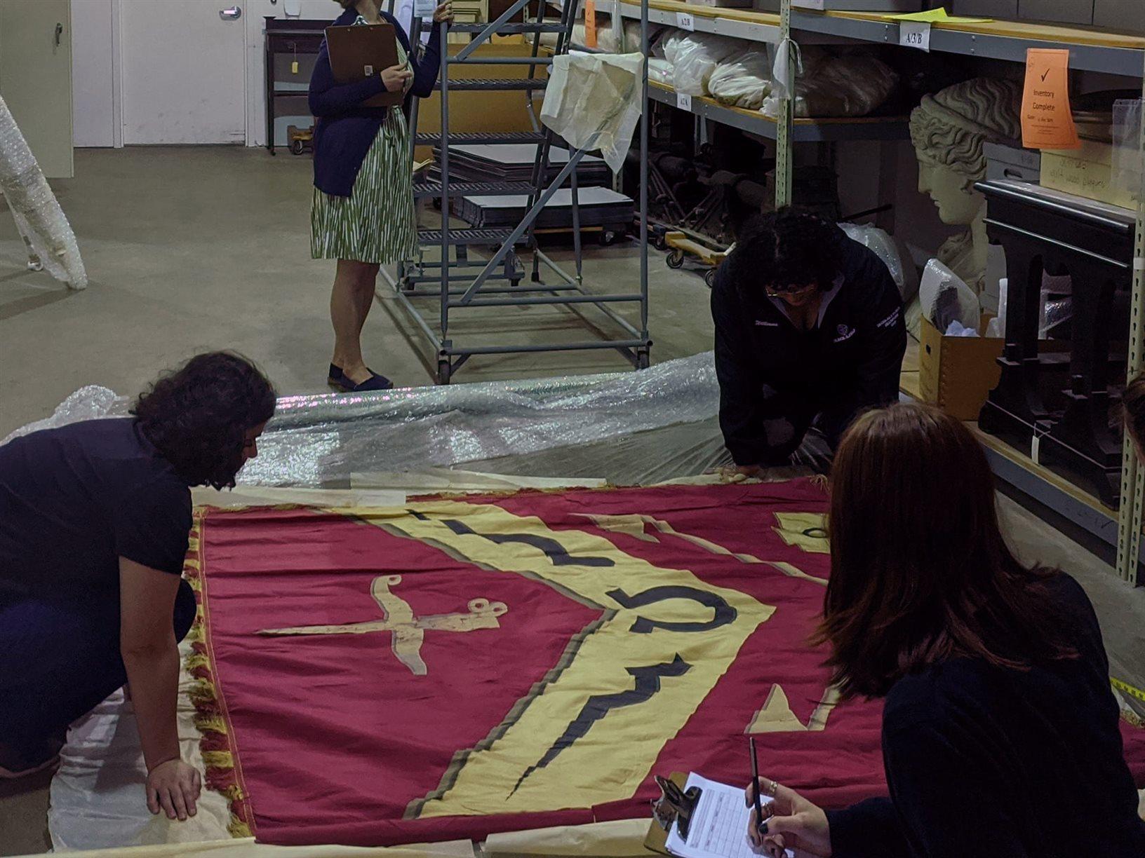 students gathered around an object