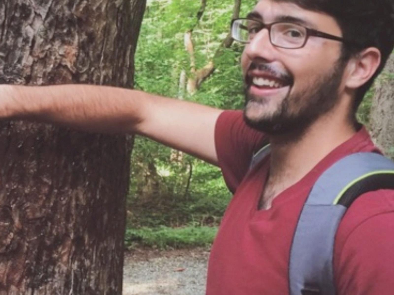 Drexel student in front of a tree