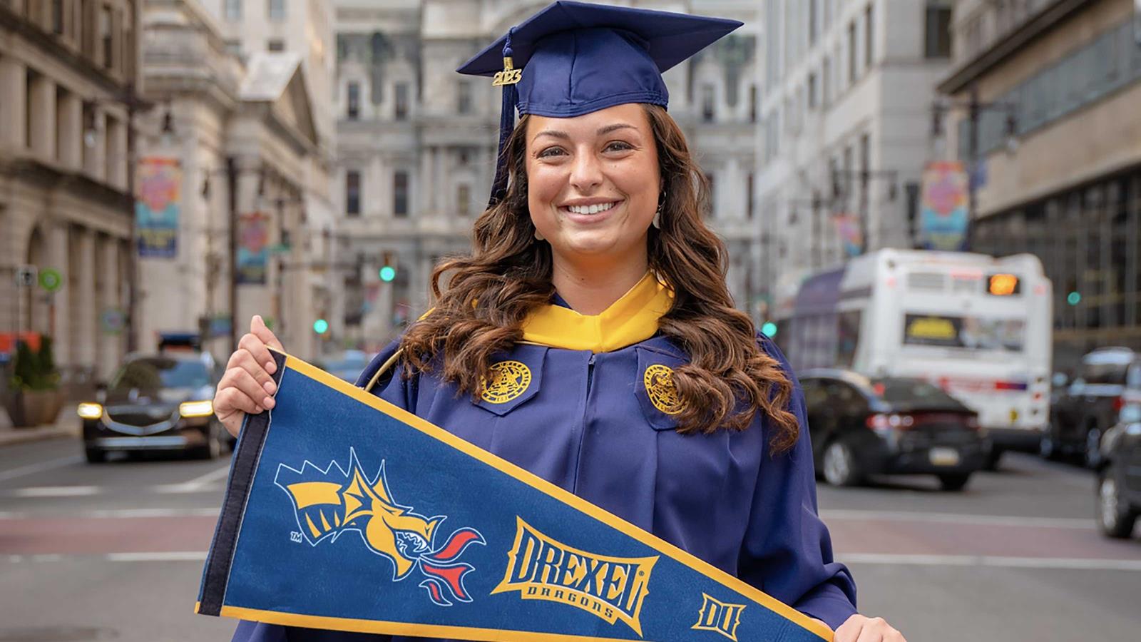 Drexel graduate in front of City Hall