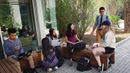 Five students hang out near the benches outside of Korman Center.