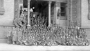 Drexel ROTC students sitting in front of the Main Building in 1919