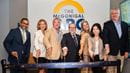 Preparing to cut the ribbon at the ARC
