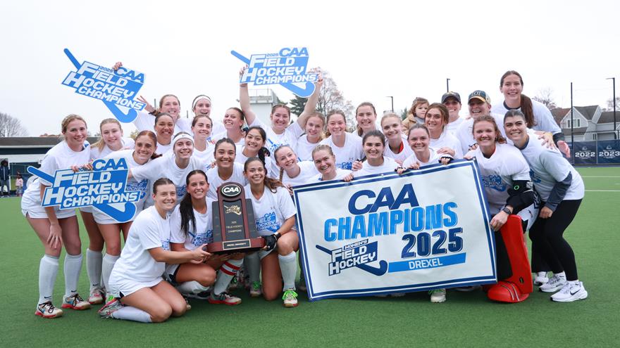 The field hockey team poses with a CAA Champions 2025 banner