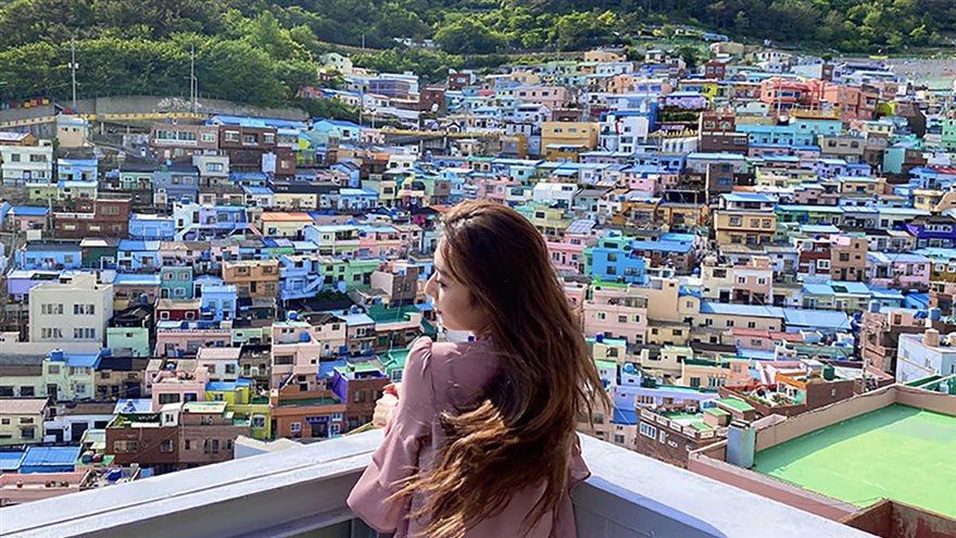 Karen Lee, a fourth-year marketing and organizational management student who studied abroad this spring in South Korea, admires the views of the cultural village in Busan. Photo courtesy of Lee.