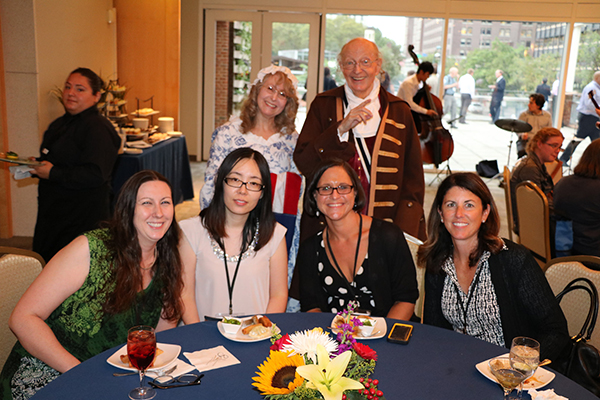 A picture of conference attendees with Ben Franklin and Betsy impersonators