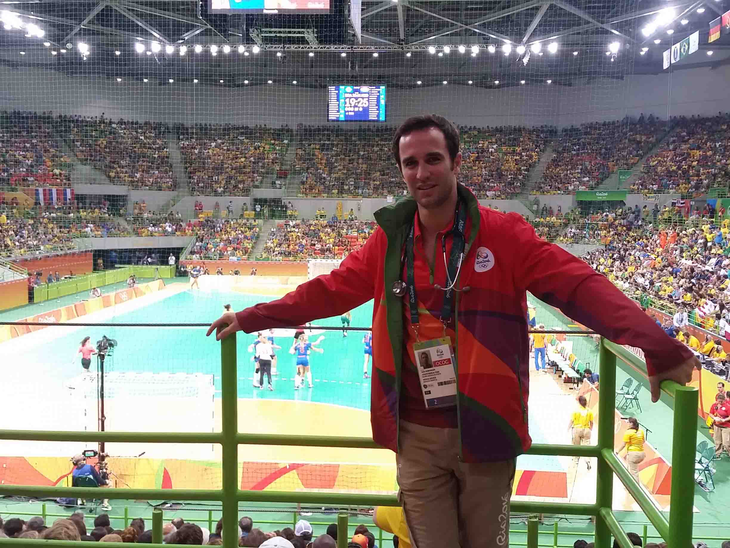 Justin posing in front of handball court at Rio Olympics